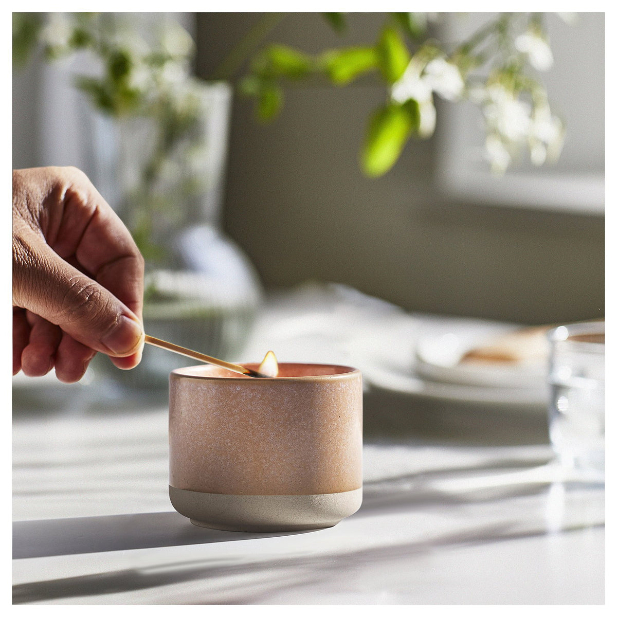 Scented candle in ceramic jar